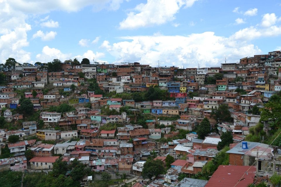 Venezuela's capital, Caracas, is ringed with barrios- shanty towns that sprung up in the last century as Dutch Disease strangled the agricultural sector. Venezuelans who moved from the countryside to the city often found nothing but these slums awaiting them. The world over, rural migrants are funnelled into our industrial cities looking for work. Instead, many end up as surplus labour, relegated to a periphery role in society. From Casablanca's muddy slums to the grimy rims of China's factory cities, this is a reality for millions of people worldwide. If the Chavez era achieved anything, it was including the people of the barrios into society. Venezuelans from poor areas like this make up the support base of Chavismo. People from places like this came down from the hillsides to demand Chavez's return when he was temporarily ousted from power by a US backed coup in 2002. Today, barrios across the country are being rehabilitated under Barrio Tricolor, a national project aimed at refurbishing the barrios; maintaining their cultural significance, but improving conditions and safety. 