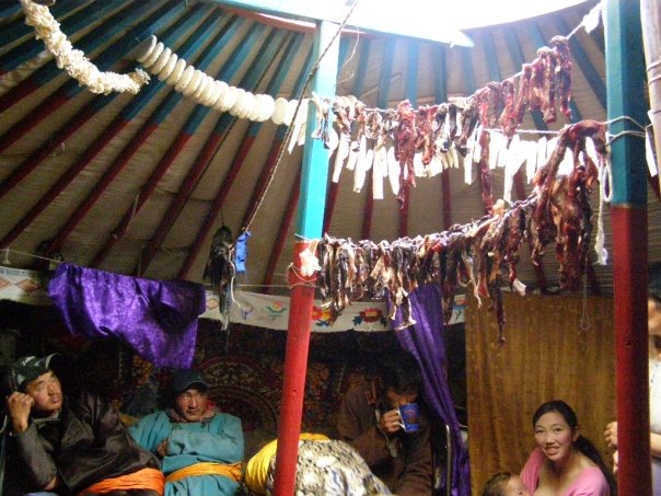 Inside a Mongolian ger. Around 30% of Mongolia's population are nomadic or semi-nomadic; most live in gers just like this. Well insulated, gers are comfortable and durable, and can be dismantled and reassembled within hours. However, after spending a month with this family of herders in the west of Mongolia, I found that these people live in tough conditions. Breakfast, lunch and dinner always consisted of a bowl of blood and bone marrow soup, and occasionally a chunk of rock hard goat cheese. Offal and died strips of meat (check out the roof) made for rare treats. Whatever the meal though, in Mongolia it's always washed down with some salty butter tea. Beyond Ulaanbaatar, most of Mongolia is untamed wilderness sprinkled with nomad camps. The isolation and simplicity of life on the steppe can at times border on the medieval, down to the occasional outbreak of bubonic plague. 